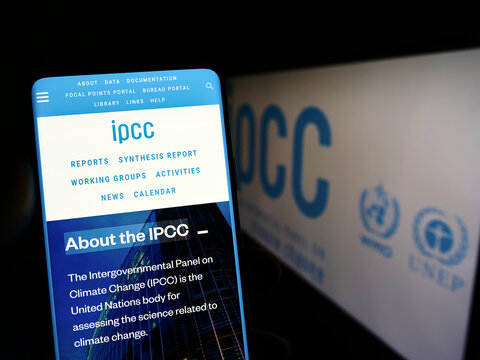 Stuttgart, Germany - 09-25-2022: Person holding mobile phone with webpage of Intergovernmental Panel on Climate Change (IPCC) on screen with logo. Focus on center of phone display.