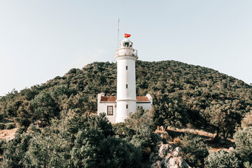 Fototapeta na wymiar Gelidonya Lighthouse at Karaoz, Antalya, Turkey facing to Mediterranean sea and three Islands on Lycian Way.