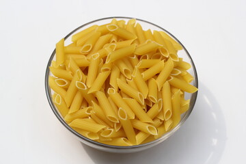 Heap of pasta decorated on a bowl on white background