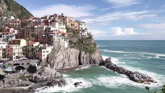 Seacoast of Cinque Terre with its villages and nature in Italy during a gloomy day of spring