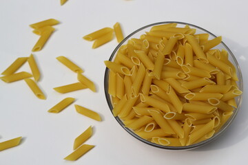 Heap of pasta decorated on a bowl on white background