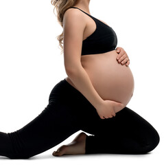 Fototapeta Young pregnant girl doing exercising isolated shot obraz