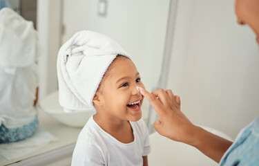 Skincare, cream and girl child at home with mother with a happy smile in a bathroom. Happiness of a...