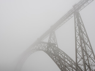 Old iron bridge in the morning mist