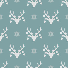seamless winter pattern with grey silhouette of deer head with christmas tree toy balls on horns and snowflakes. vector flat Christmas ornament on powder blue background