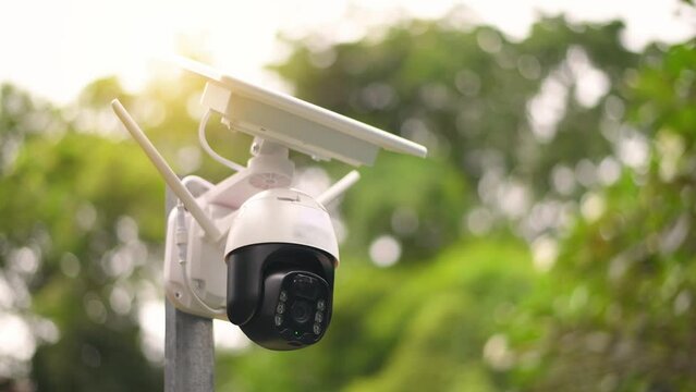 Solar cells panel used energy with motion speed Wi-Fi dome IP CCTV 4G solar camera with sim card system technology signal for looked around security area for safety concept.