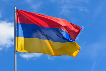 The flag of Armenia is a rectangular banner consisting of horizontal red, blue and orange stripes...