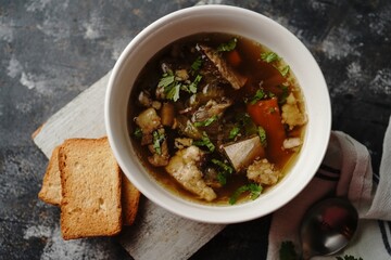 Homemade Lamb Goat or Mutton soup stew served in a bowl, selective focus