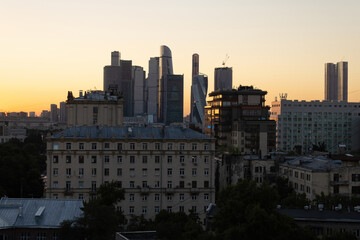 Houses and skyscrapers of Moscow. Old buildings and modern skyscrapers. Evening in Moscow, capital of Russia.