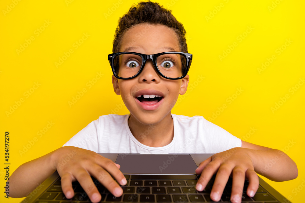 Sticker Photo of funny funky clever boy online study learner wear glasses look web camera netbook interesting lesson isolated on yellow background