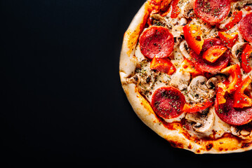 Pizza with Mozzarella cheese, salami, tomato sauce, onion, pepper, mushrooms
