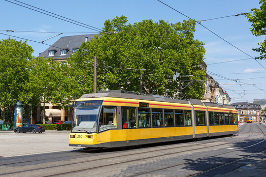 Light rail tram type GT6 public transport transit at stop main station in Karlsruhe, Germany