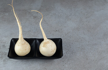 Harvesting fresh white turnips vegetable