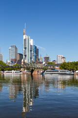 Frankfurt skyline with Main river and Eiserner Steg Bridge travel traveling portrait format in Germany