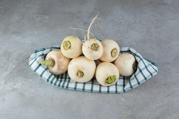 Harvesting fresh white turnips vegetable