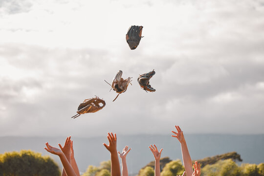 Team Celebrate Winning, Game Of Baseball Or Trophy By Throw Gloves In Air. Softball Squad Happy For Victory In Championship Or Competition Together, Lift Hands To The Sky In Happiness And Celebration