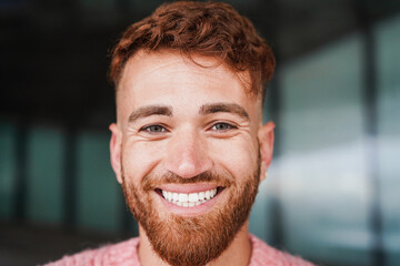 Young red hair man smiling on camera outdoor - Powered by Adobe