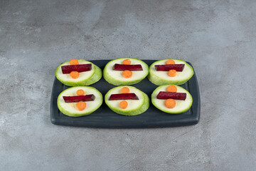 Sliced delicious vegetables on a gray background