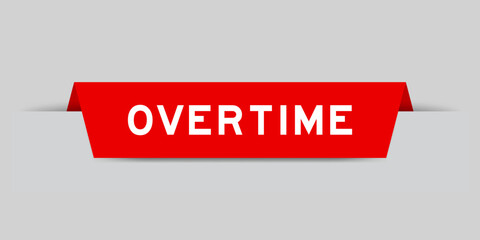 Red color inserted label with word overtime on gray background