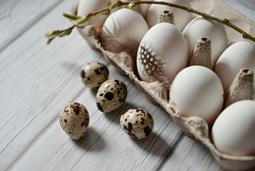 Heap of quail eggs decorated with feather. Organic food. Rustic style. Top view.