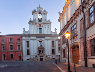 Fototapeta premium Krakow. Old houses in night illumination at dawn.