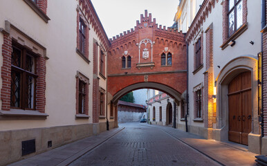 Obraz premium Krakow. Old houses in night illumination at dawn.