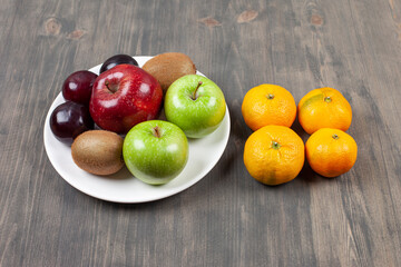 Delicious various fruits on a wooden table
