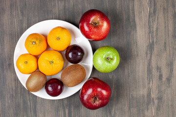 Delicious various fruits on a wooden table