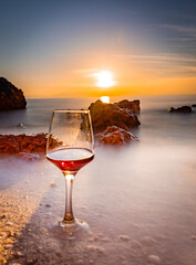 glass of wine on the beach