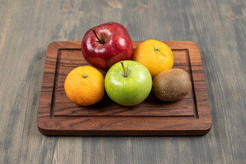 Delicious various fruits on a wooden table