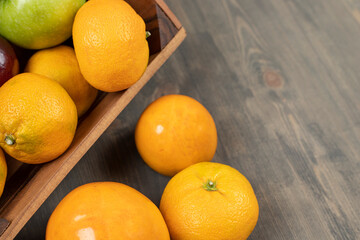 Sweet tangerines or mandarins on a wooden table