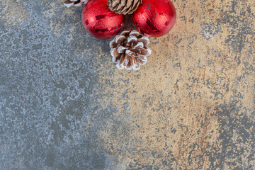 Christmas balls with Christmas pinecones on a dark background