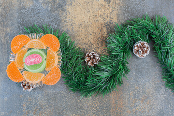 Sugary fruit jelly candies with pinecones and bunch of Christmas tree