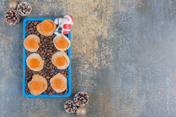 Dried slices of fruit with jelly candies and coffee beans