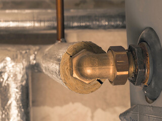 Heating pipes insulated with rock wool in a boiler room. Energy saving and energy cost reduction...