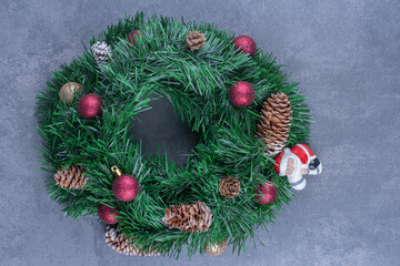 A Christmas wreath with Santa Claus toy