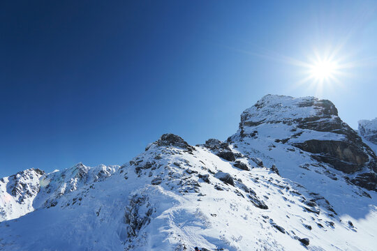 Beautiful view of Koscielec Peak - "Kościelec", High Tatra Mountains, Carpathian, Poland. The sun is shining over the top of the mountain. View from the Karb Pass.