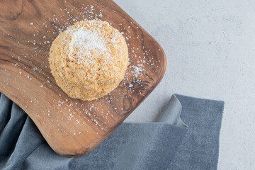 Squirrel cake on a board on marble background