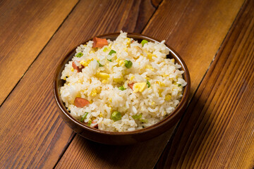 Yangzhou fried rice on wooden background