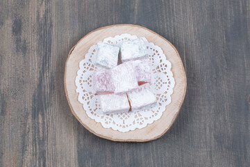 Fruity sweet treats on wooden piece