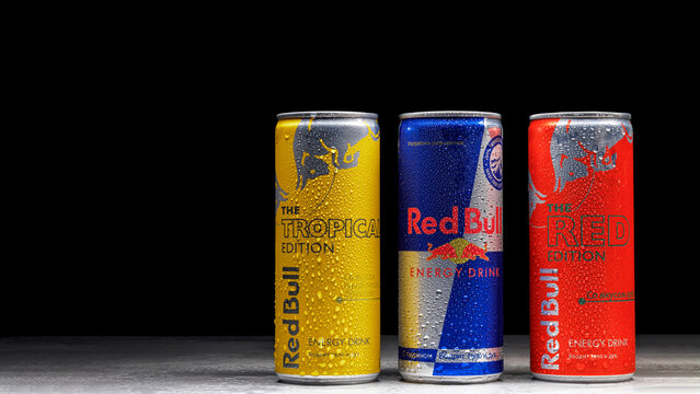 Can of Red Bull Energy Drink. Group Red Bull On Black Background. MINSK, - September 28, 2022 Stock-foto | Adobe Stock