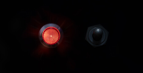 Switched ON. Red indicator or ON lamp with a toggle switch next to it.  Red status lamp with a...
