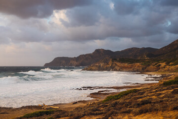 Sardinia coastline at sunset golden light