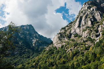 Granite rocks mountain walls in an alpine italian Val di Mello valley