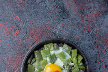 Green beans cooked with egg in a pan