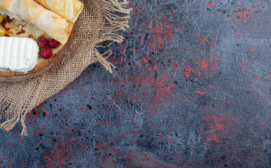 Crepes with white cheese and raspberries