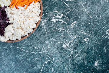 Salad with chopped cabbage, cauliflowers and carrots