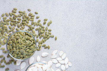 Pumpkin seeds isolated on concrete background