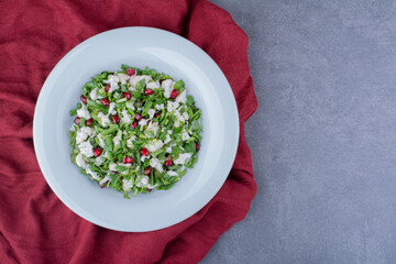 Green salad with herbs, cauliflower and pomegranate seeds