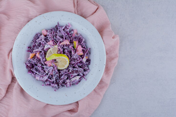 Salad with chopped and minced purple onion and cabbage